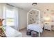 Charming bedroom with a decorative bed frame, bedside table, and a window with a beautiful view at 365 N Grand Oak Dr, Mooresville, IN 46158
