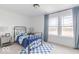 Bedroom with a modern bed, and an open window providing ample natural light and outdoor views at 365 N Grand Oak Dr, Mooresville, IN 46158