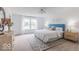Bright main bedroom with large windows, a dresser, and neutral decor at 365 N Grand Oak Dr, Mooresville, IN 46158
