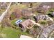 Breathtaking aerial view of the property, showcasing the pool, spacious yard, and beautiful landscaping at 3976 Bent Tree Ln, Greenwood, IN 46143