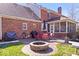 Enjoy outdoor living on this backyard patio with a fire pit and seating, perfect for entertaining at 3976 Bent Tree Ln, Greenwood, IN 46143