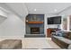 Basement area with a fireplace, plush carpet and natural light from above-ground windows at 3976 Bent Tree Ln, Greenwood, IN 46143
