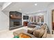 Basement area featuring a cozy fireplace, plush carpet, and a comfortable seating area at 3976 Bent Tree Ln, Greenwood, IN 46143