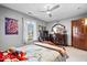 This bedroom features a ceiling fan, a window, and gray walls with an Avengers movie poster at 3976 Bent Tree Ln, Greenwood, IN 46143
