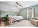 Bedroom with ceiling fan, one window, green walls, carpet floors, and double bed at 3976 Bent Tree Ln, Greenwood, IN 46143