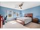 Bedroom with a desk, chair, bed and two windows offering exterior views at 3976 Bent Tree Ln, Greenwood, IN 46143