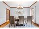 Open-concept dining room with neutral walls, wood floors, and seating for six at 3976 Bent Tree Ln, Greenwood, IN 46143