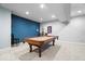 Basement game room with a pool table, neutral carpet, and blue accent wall at 3976 Bent Tree Ln, Greenwood, IN 46143