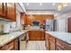 Kitchen featuring granite countertops, stainless steel appliances, and wooden cabinets at 3976 Bent Tree Ln, Greenwood, IN 46143