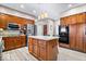 Kitchen featuring granite countertops, stainless steel appliances, and wooden cabinets at 3976 Bent Tree Ln, Greenwood, IN 46143