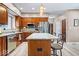 Kitchen featuring granite countertops, stainless steel appliances, and wooden cabinets at 3976 Bent Tree Ln, Greenwood, IN 46143