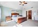 Spacious main bedroom features vaulted ceiling, soft carpet and decor, with ensuite bath at 3976 Bent Tree Ln, Greenwood, IN 46143