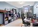 Office with light-blue walls, desk, shelves, and carpet floors at 3976 Bent Tree Ln, Greenwood, IN 46143