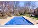 Backyard pool with a blue cover and surrounding deck at 3976 Bent Tree Ln, Greenwood, IN 46143