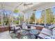 Inviting sunroom with casual seating and beautiful views of the backyard at 3976 Bent Tree Ln, Greenwood, IN 46143