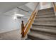 Carpeted stairs leading to the finished basement, showcasing ample space and neutral decor at 40 Twinshore Ct, Carmel, IN 46033