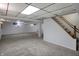 Spacious finished basement featuring neutral carpet, white walls, and ample lighting at 40 Twinshore Ct, Carmel, IN 46033