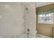 Well-lit bathroom featuring a tiled shower/tub combination and a window at 40 Twinshore Ct, Carmel, IN 46033