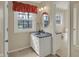 Charming bathroom with modern vanity, large mirror, and abundant natural light at 40 Twinshore Ct, Carmel, IN 46033