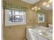 Bathroom featuring a double vanity, a window, and neutral colored walls at 40 Twinshore Ct, Carmel, IN 46033