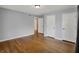 Bright bedroom featuring hardwood floors, light gray walls, and white trim at 40 Twinshore Ct, Carmel, IN 46033