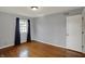 Cozy bedroom with hardwood floors and a window providing natural light at 40 Twinshore Ct, Carmel, IN 46033