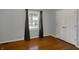 Bedroom with hardwood floors, a large window, and a closet at 40 Twinshore Ct, Carmel, IN 46033