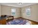 Cozy bedroom with wood floors, a desk, and built-in shelving near the window, creating a functional space at 40 Twinshore Ct, Carmel, IN 46033