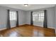 Bedroom with hardwood floors, two windows, and neutral colored walls at 40 Twinshore Ct, Carmel, IN 46033