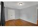A spacious bedroom featuring hardwood floors, closet, and neutral walls at 40 Twinshore Ct, Carmel, IN 46033