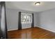 Well-lit bedroom featuring hardwood floors and soft gray walls at 40 Twinshore Ct, Carmel, IN 46033