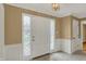 Bright entryway with decorative glass sidelights and tiled flooring at 40 Twinshore Ct, Carmel, IN 46033