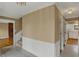 Hallway view showcasing access to a staircase, kitchen and other living areas at 40 Twinshore Ct, Carmel, IN 46033