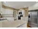 Updated kitchen features stainless appliances, ample counter space, and white cabinetry at 40 Twinshore Ct, Carmel, IN 46033
