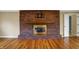Living room featuring a brick fireplace, hardwood floors and neutral walls at 40 Twinshore Ct, Carmel, IN 46033