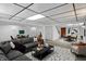 This spacious living room features recessed lighting, a modern color palette, and a dining area at 40 Twinshore Ct, Carmel, IN 46033