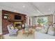 Cozy living room featuring a brick fireplace, comfortable seating and stylish decor at 40 Twinshore Ct, Carmel, IN 46033
