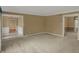 Spacious living room with neutral carpet and paint, offering a versatile layout and welcoming atmosphere at 40 Twinshore Ct, Carmel, IN 46033