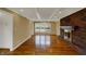 Bright living room with hardwood floors, a brick fireplace and a large window at 40 Twinshore Ct, Carmel, IN 46033