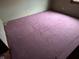 Bedroom featuring purple carpet, green walls and a glimpse of base trim at 413 W 8Th St, Muncie, IN 47302