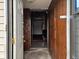 Interior view from the front door looking into a wood-paneled entryway and additional rooms at 413 W 8Th St, Muncie, IN 47302