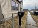 A mailbox with the numbers '413' sits on the sidewalk in front of the home at 413 W 8Th St, Muncie, IN 47302