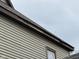 Close up view of the home's exterior siding and trim, showing areas of deterioration at 413 W 8Th St, Muncie, IN 47302