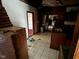 Messy kitchen featuring tile floors at 413 W 8Th St, Muncie, IN 47302