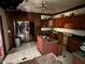 Kitchen featuring wood cabinets and tile floors at 413 W 8Th St, Muncie, IN 47302