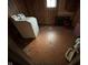 Laundry area featuring a laundry machine and wood paneling at 413 W 8Th St, Muncie, IN 47302
