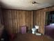 This room features wood paneling, and a toilet at 413 W 8Th St, Muncie, IN 47302