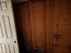 Unfinished storage room with wood paneling and shelving at 413 W 8Th St, Muncie, IN 47302