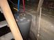 Water heater with exposed pipes in the basement at 413 W 8Th St, Muncie, IN 47302