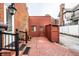Cozy backyard exterior with brickwork, back stairway, and vintage details, offering a quaint outdoor space at 424 E Vermont St, Indianapolis, IN 46202